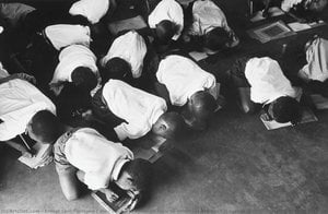 Students Kneel On Floor To Write. Government Is Casual About Furnishing Schools For Blacks - Photographs From House Of Bondage, 1958-66 — Ernest Levi Tsoloane Cole, Documentary Photography